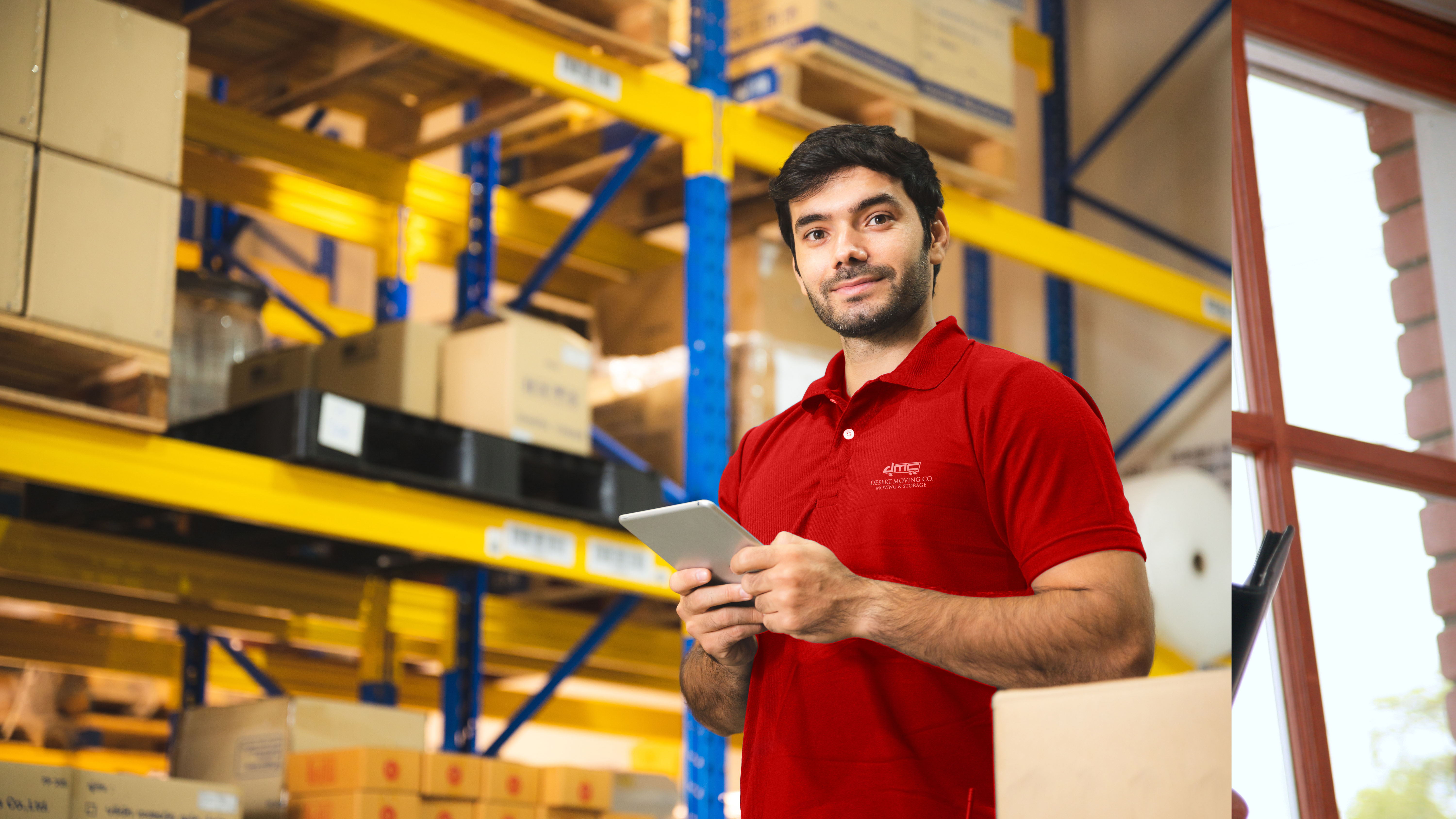 DMC employee with tablet managing secure storage facility